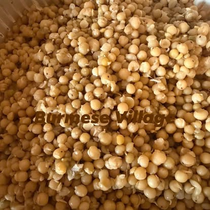 Close-up of seasoned yellow peas glistening with oil